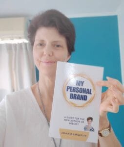 Jennifer holding My Personal Brand book