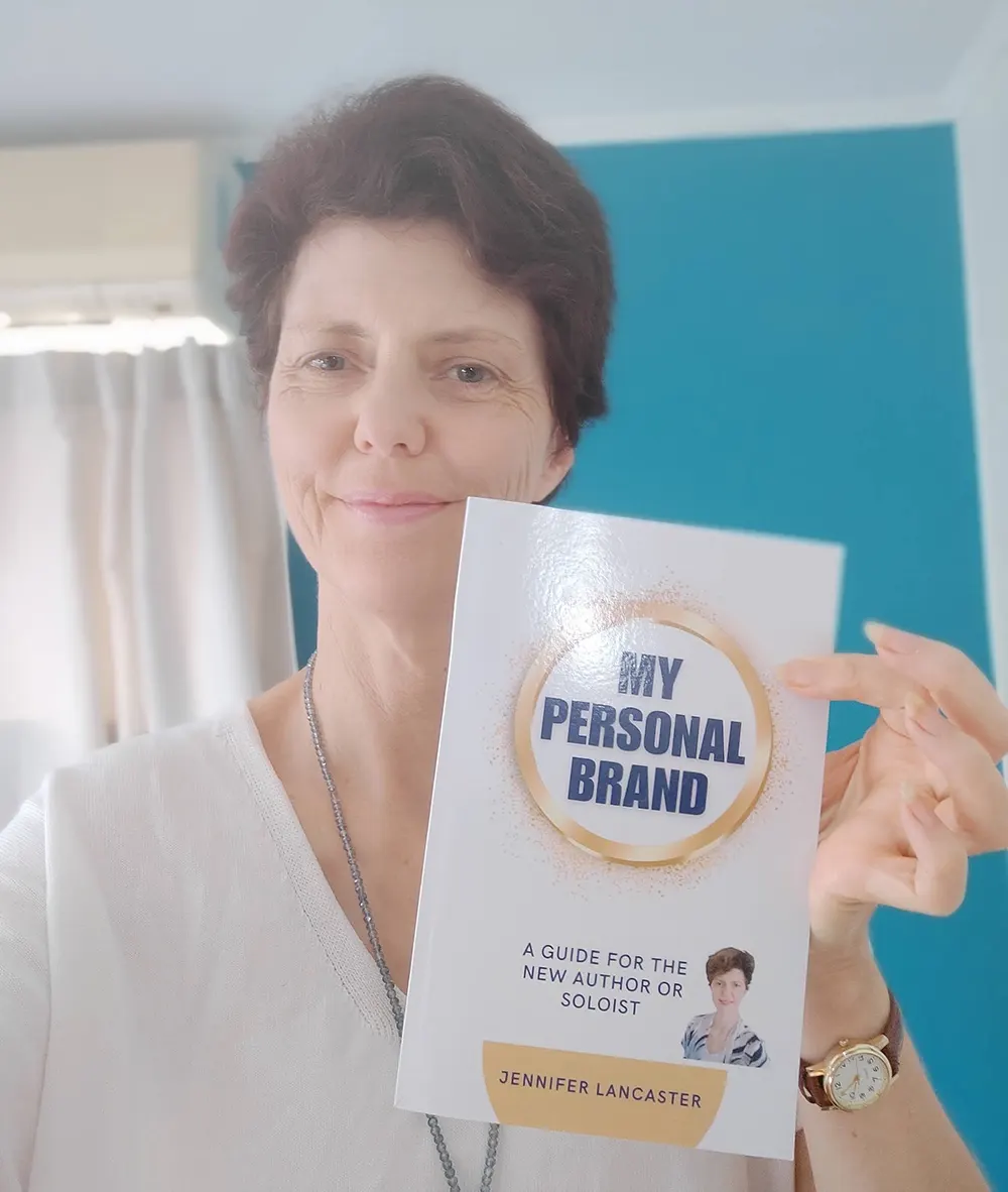 Jennifer holding My Personal Brand book